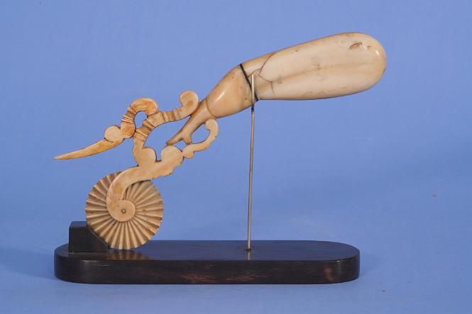 WHALE IVORY AND BALEEN PIE CRIMPER IN THE FORM OF A "NAUGHTY LADIES LEG