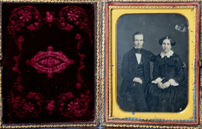Quarter Plate Daguerreotype Of a Man and woman, pictured seated with the man's arm around her. Gilt accented jewery. Embossed velvet case interior with "Brady's Gallery 359 Broadway New York"