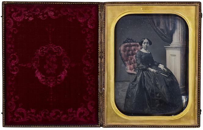 Polychrome Full Plate Daguerreotype Depicting A Women in a Highback Chair with the Original Case, American Circa 1850