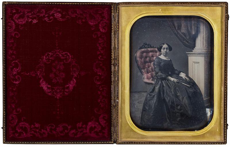 Polychrome Full Plate Daguerreotype Depicting A Women in a Highback Chair with the Original Case, American Circa 1850