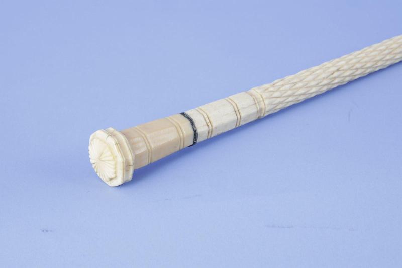 Scrimshaw Cane with whale ivory grip and bold carved whale bone shaft with diamond and rope pattern, mid-19th century
