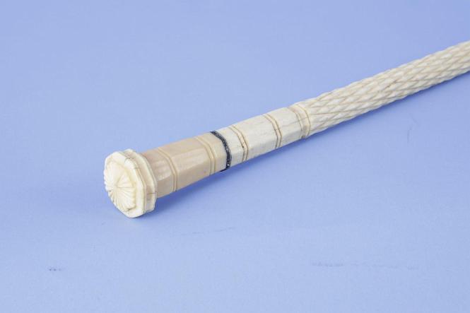 Scrimshaw Cane with whale ivory grip and bold carved whale bone shaft with diamond and rope pattern, mid-19th century