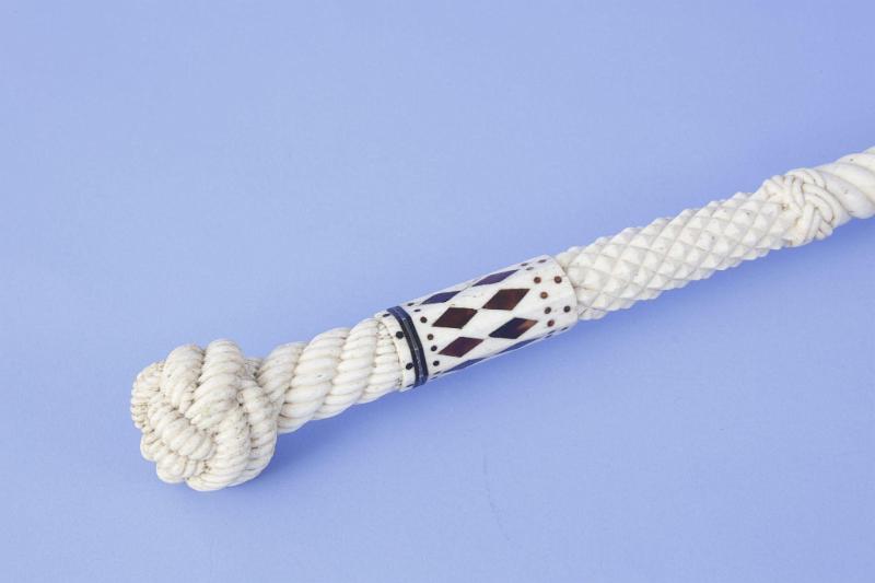 Whale ivory and whale bone cane with finely carved monkey fist and rope grip with  raised diamond and rope carved shaft, mid-19th century