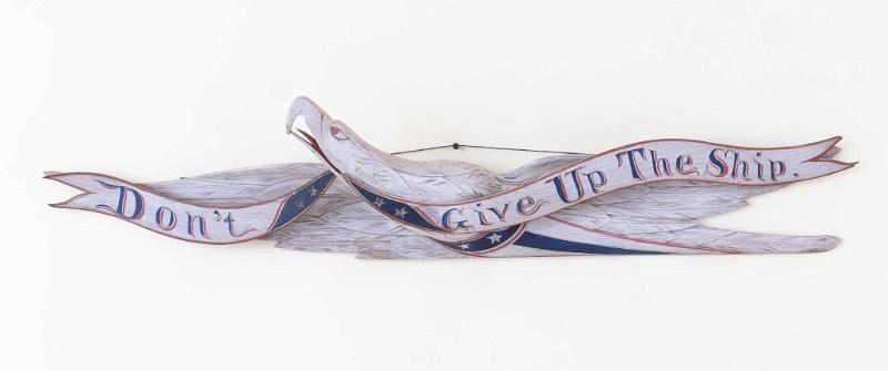 Carved and painted Thirty Eight Inch Carved Eagle with Painted Banner with the Slogan "Don't Give up the Ship in Red, White and Blue Paint with Addtional Paint Decorations by John Hale Bellamy circa 1885.