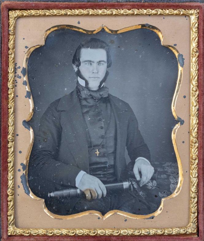 Sixth Plate Daguerreotype of a Seated Ship's captain Holding a Telescope in His Hand