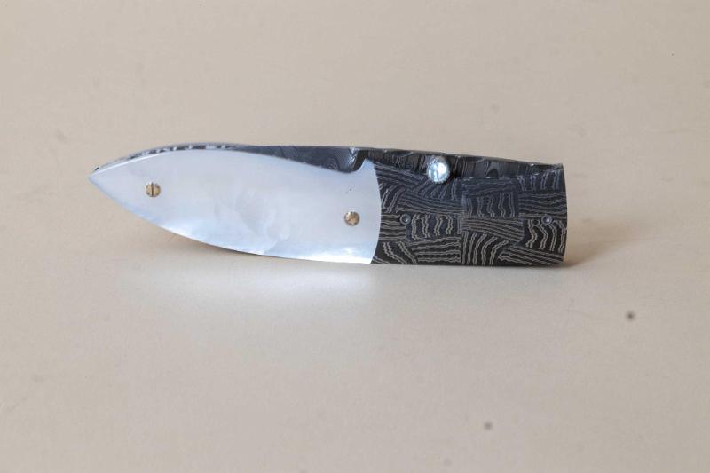 Jerry Corbit Custom Knife with Mosaic Design Damasuus Blade by Robert Eggerling with Mother of Pearl Grips and Liner Lock release. 