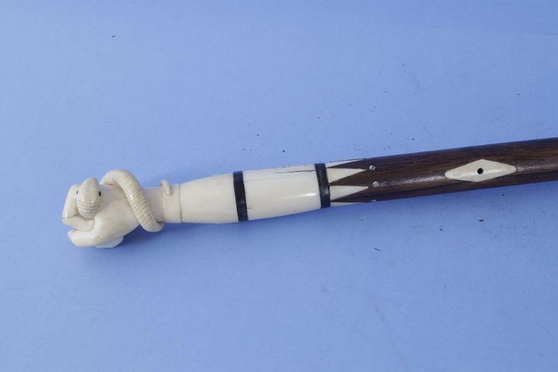 Exceptional Whale Ivory and Wood scrimshaw Whale Ivory and Wood Cane with Fist Crushing Serpent, American Engraved "Daniel T. Purrinton, Brunswick", American Mid 19th Century