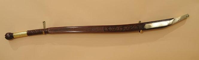 Carved Tiller With Exceptional Thematic Carvings